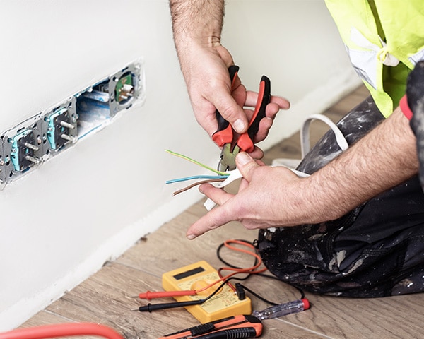 electrician at work, home renovation, electrical installation, Hand of an electrician, handyman at work